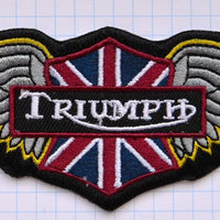 Uzšuve - Triumph brīvības spārni